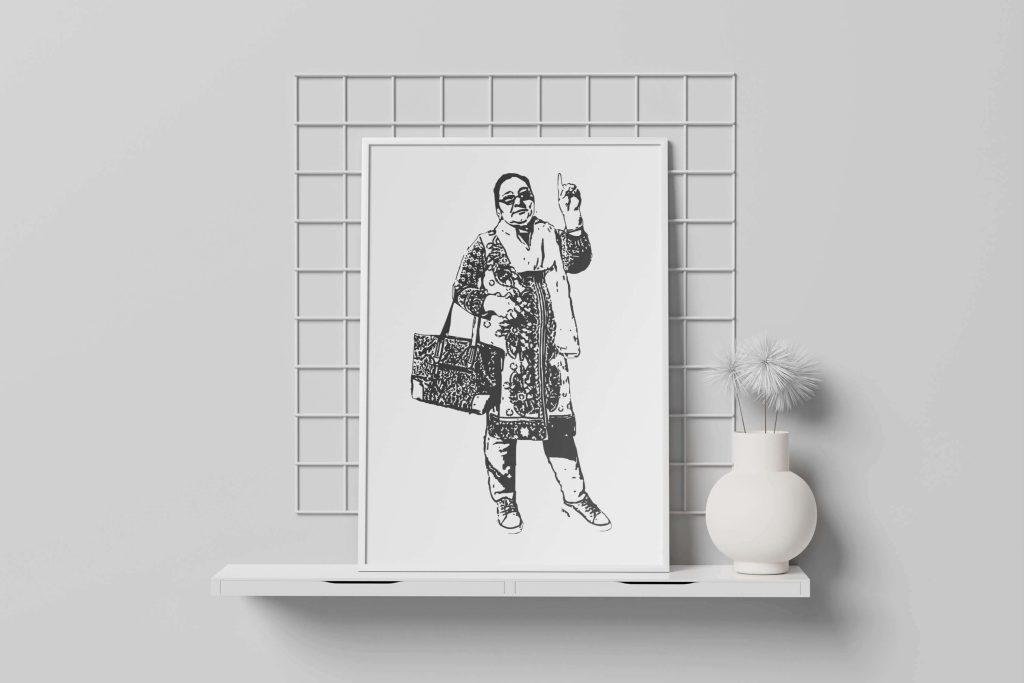 Black and white sketch of a woman in traditional attire holding a patterned bag, framed and displayed on a minimalist white shelf.